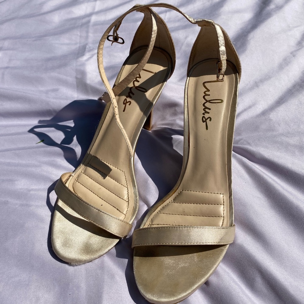 Gold stiletto high heels